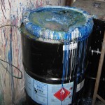 Hazardous waste container in poor condition