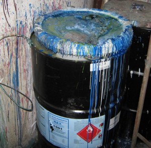 Hazardous waste container in poor condition