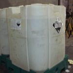 Image of rigid IBC with Class 8 Corrosive placard