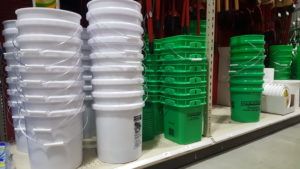 Plastic pails on store shelf