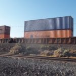 Freight containers loaded on rail car