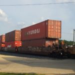 Freight containers on rail cars